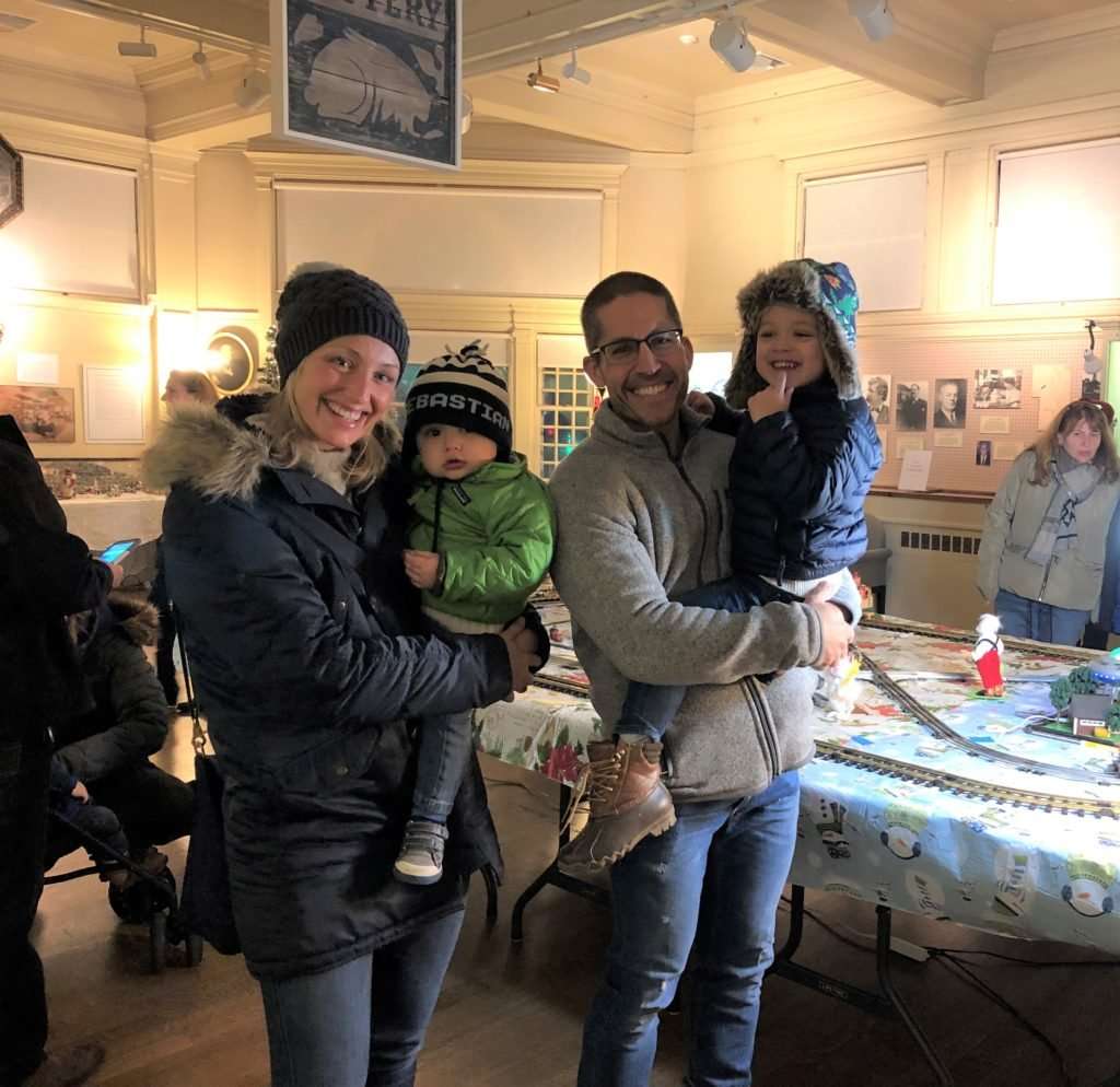 Family at museum during Holiday Stroll