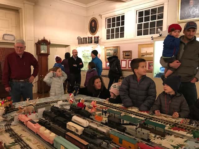 Children playing with train at Annual Dedham Square Holiday Stroll